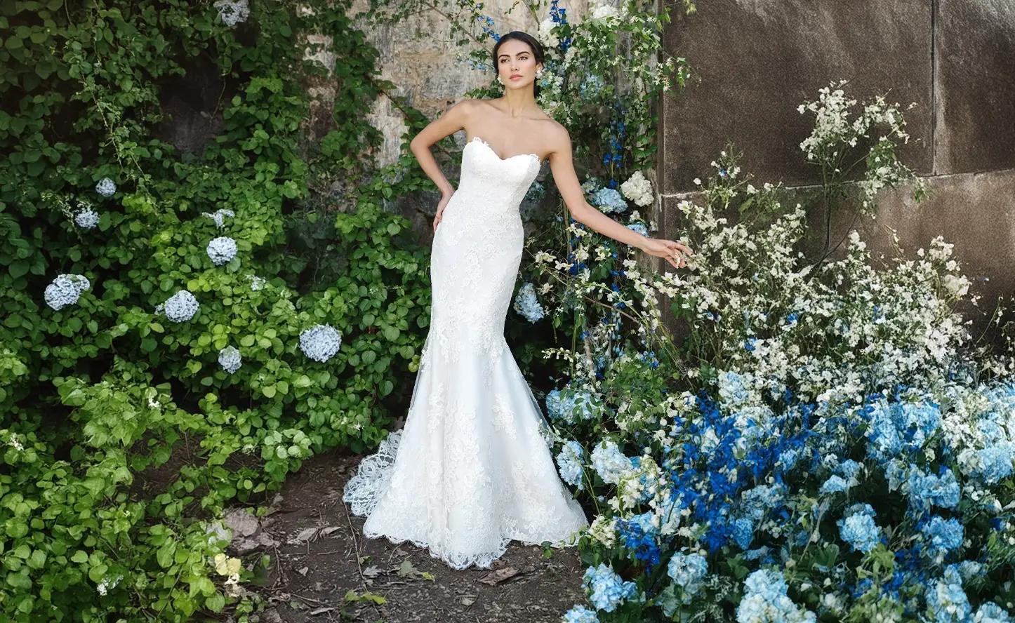 Model wearing a white Fitted style gown