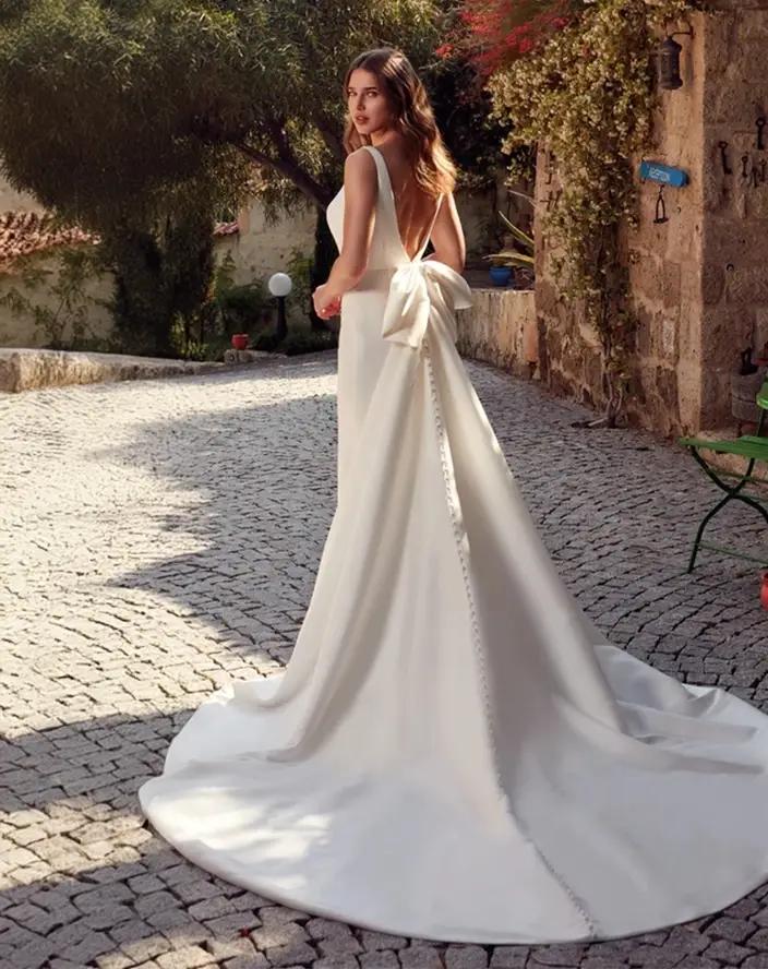 Model wearing a white Anne Barge gown