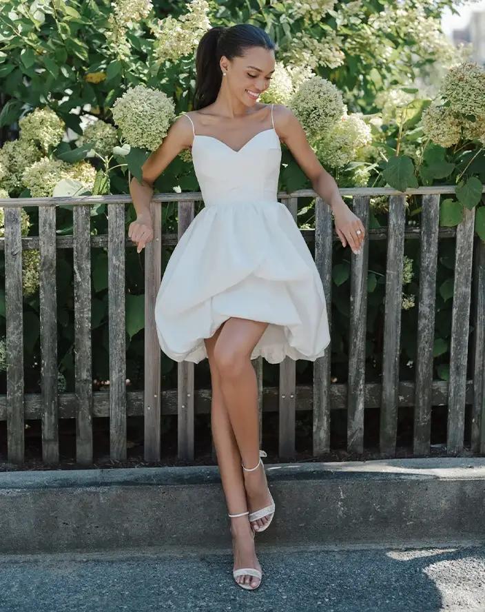 Model wearing a white Anne Barge gown