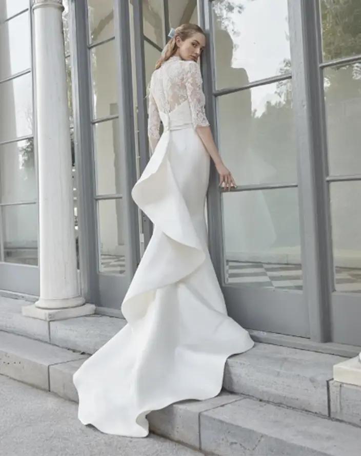 Model wearing a white Anne Barge gown