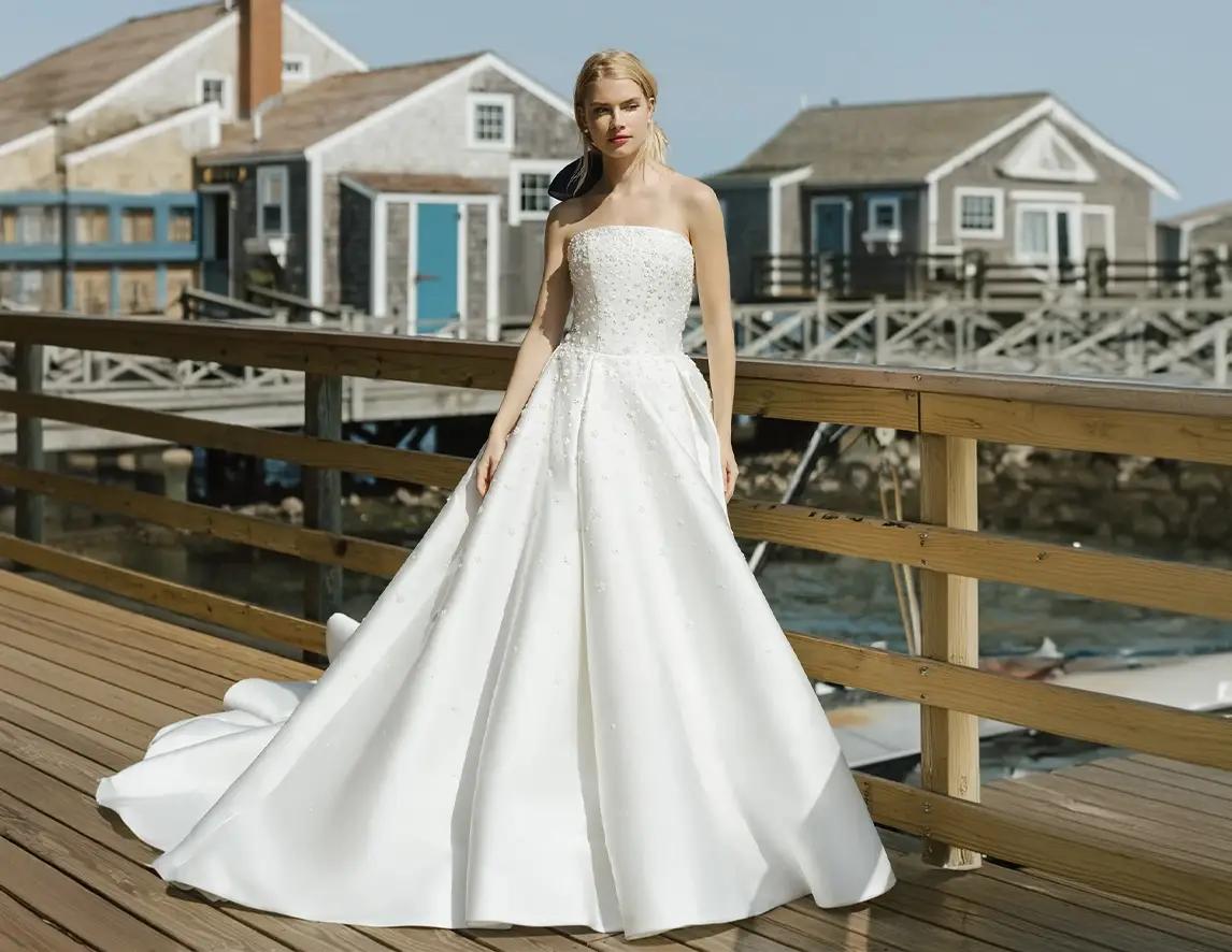 Model wearing a white Anne Barge gown